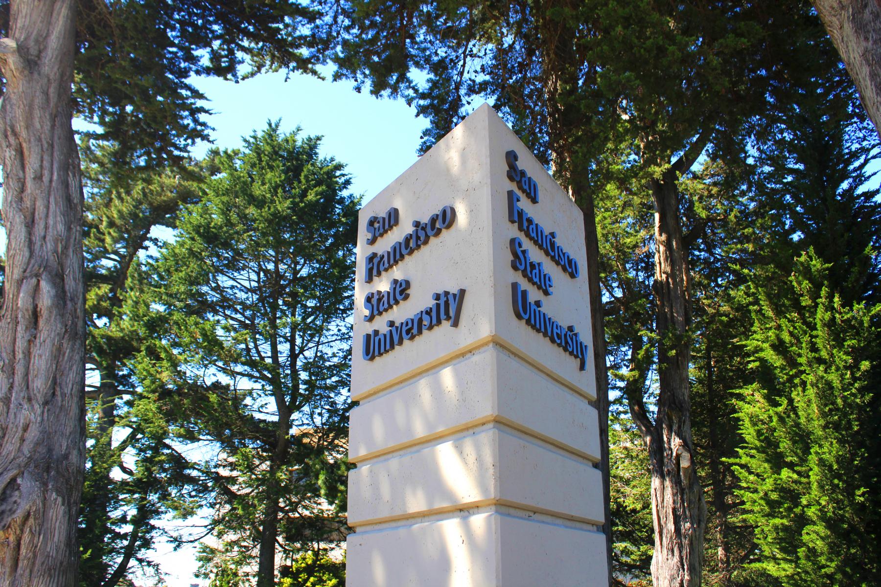 San Francisco State University sign and trees